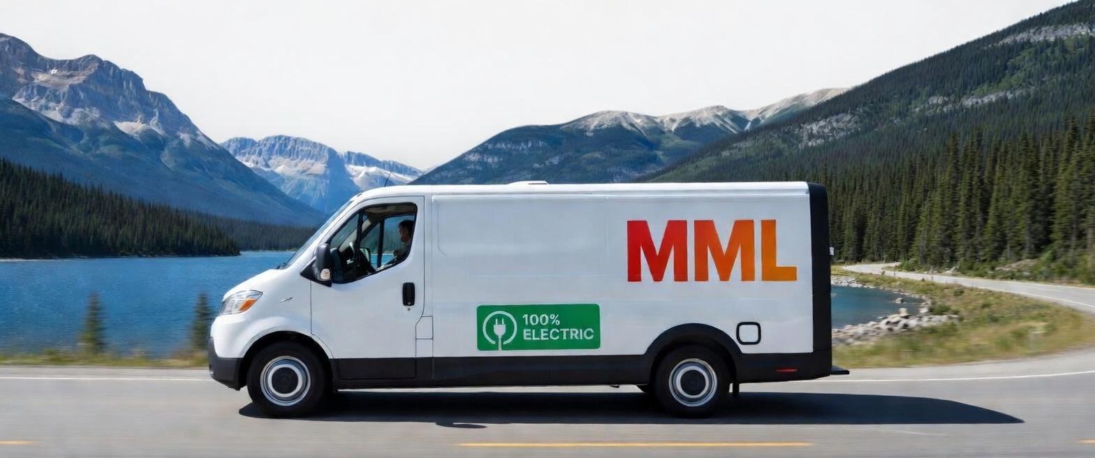 MML electric delivery van driving through British Columbia mountains